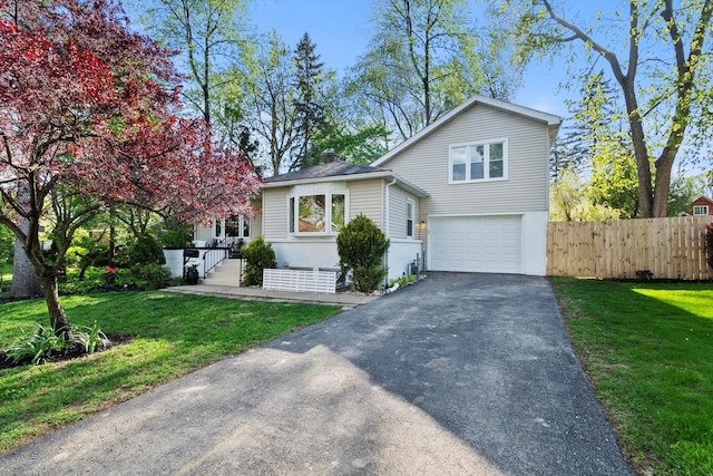 250 N Oak St, Palatine, IL 60067 - tri-level home with asphalt driveway, an attached garage, and a chimney