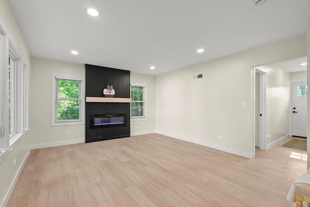 250 N Oak St, Palatine, IL 60067 - unfurnished living room featuring light wood-type flooring, a large fireplace, healthy amount of natural light, and recessed lighting