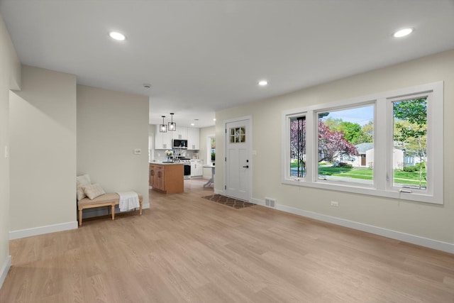 250 N Oak St, Palatine, IL 60067 - unfurnished living room with light wood finished floors, baseboards, and recessed lighting