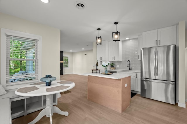 250 N Oak St, Palatine, IL 60067 - kitchen featuring freestanding refrigerator, light wood-style flooring, light countertops, and recessed lighting