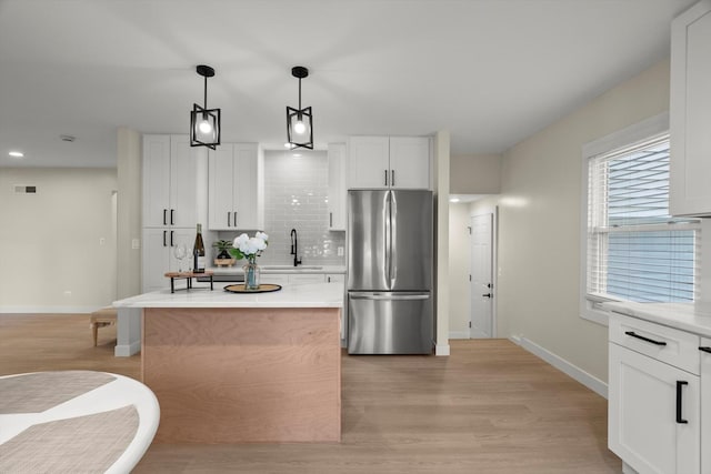 250 N Oak St, Palatine, IL 60067 - kitchen with freestanding refrigerator, baseboards, light wood-style floors, decorative backsplash, and recessed lighting