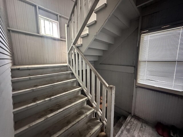 stairway with wood finished floors