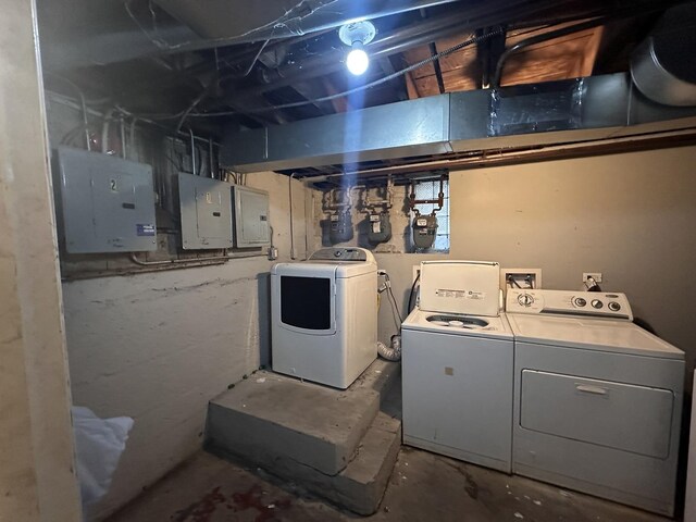 washroom with electric panel and independent washer and dryer