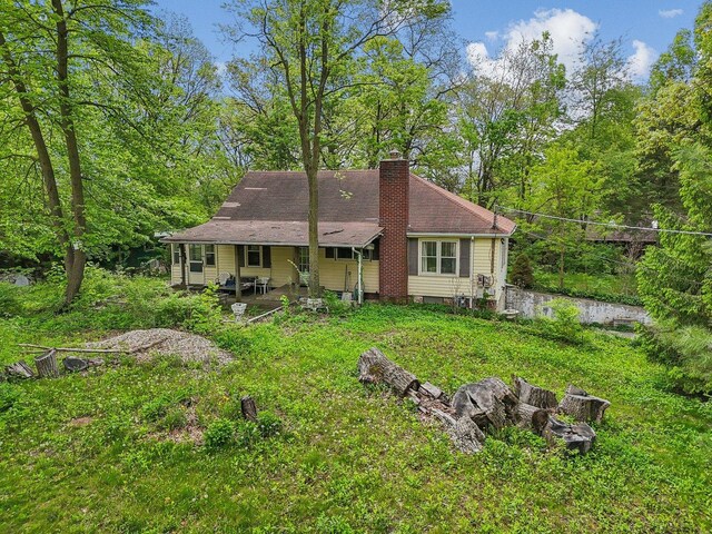 26211 W Spring Grove Rd, Antioch, IL 60002 - back of property with a chimney and a shingled roof