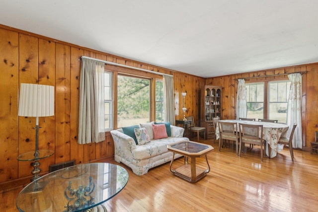 26211 W Spring Grove Rd, Antioch, IL 60002 - living area with wooden walls, plenty of natural light, and light wood-type flooring