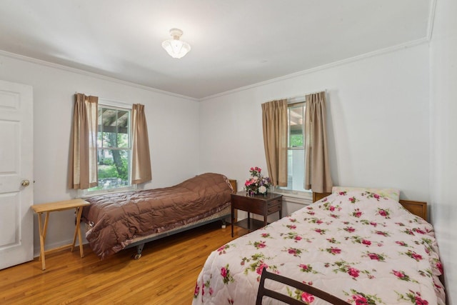 26211 W Spring Grove Rd, Antioch, IL 60002 - bedroom with ornamental molding and wood finished floors