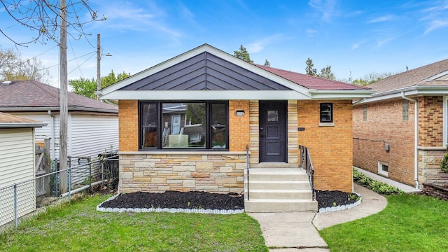 view of front of house with stone siding and brick siding