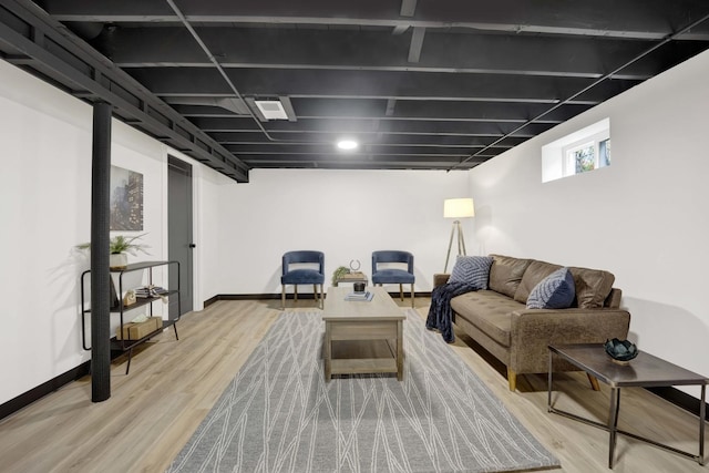 living room with wood finished floors and baseboards