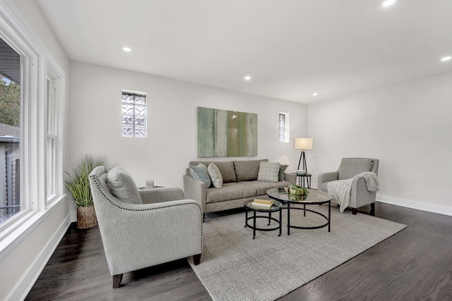 living room with healthy amount of natural light, baseboards, recessed lighting, and dark wood-style floors