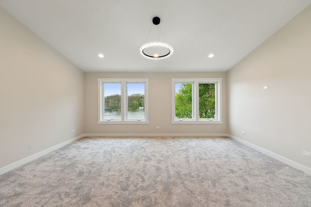 carpeted spare room with baseboards and recessed lighting