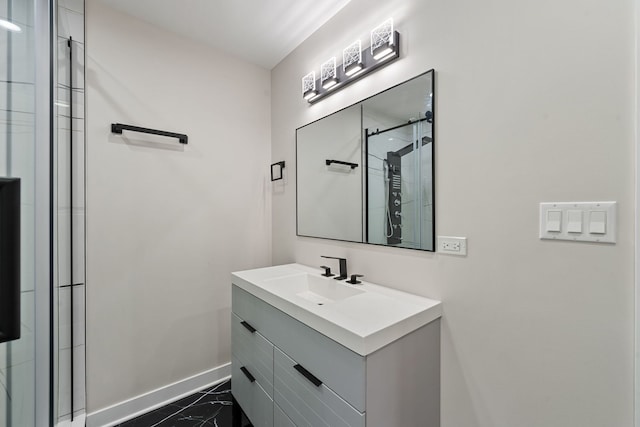 full bath with baseboards, marble finish floors, a shower stall, and vanity