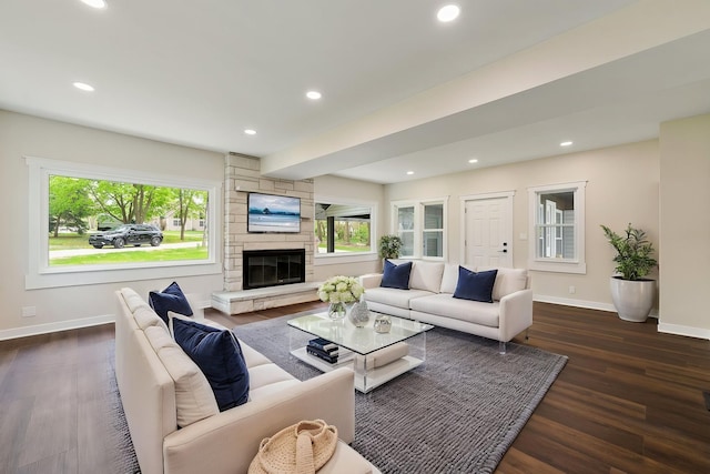 living room with baseboards, healthy amount of natural light, dark wood-style flooring, and recessed lighting