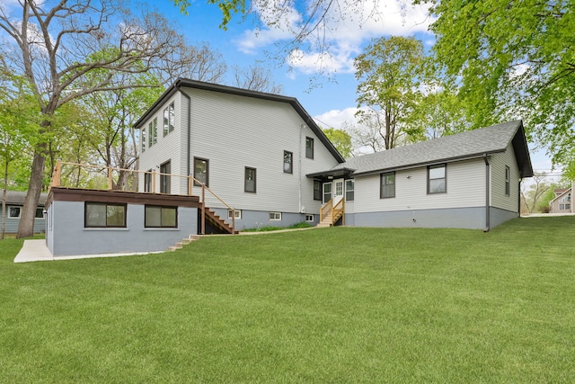 back of house featuring stairs, a lawn, entry steps, and a wooden deck