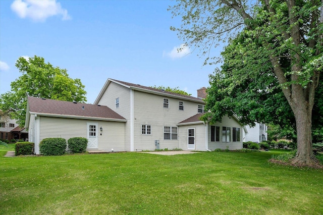 22 Cedar Gate Cir, Sugar Grove, IL 60554 - back of house with a chimney, a lawn, and a patio area