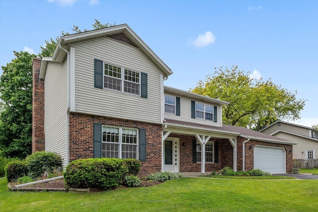 22 Cedar Gate Cir, Sugar Grove, IL 60554 - traditional-style house featuring an attached garage, brick siding, a front yard, driveway, and covered porch