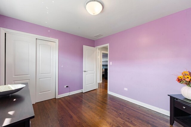 8557 W Winona St, Chicago, IL 60656 - bedroom with wood finished floors, baseboards, and a closet
