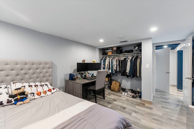 8557 W Winona St, Chicago, IL 60656 - bedroom featuring wood finished floors, a closet, and recessed lighting