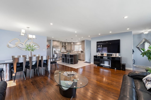 8557 W Winona St, Chicago, IL 60656 - living room with wood finished floors, recessed lighting, and baseboards