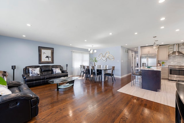 8557 W Winona St, Chicago, IL 60656 - living room with light wood-style floors, baseboards, and recessed lighting