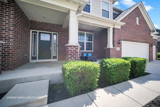 entrance to property featuring brick siding and a porch