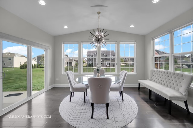 dining space with a chandelier, lofted ceiling, plenty of natural light, baseboards, and recessed lighting