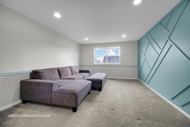living area with baseboards, recessed lighting, and light carpet
