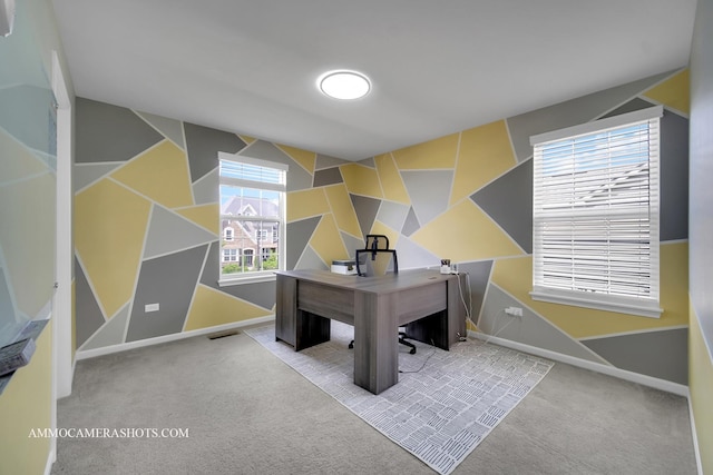 carpeted office space featuring baseboards and lofted ceiling