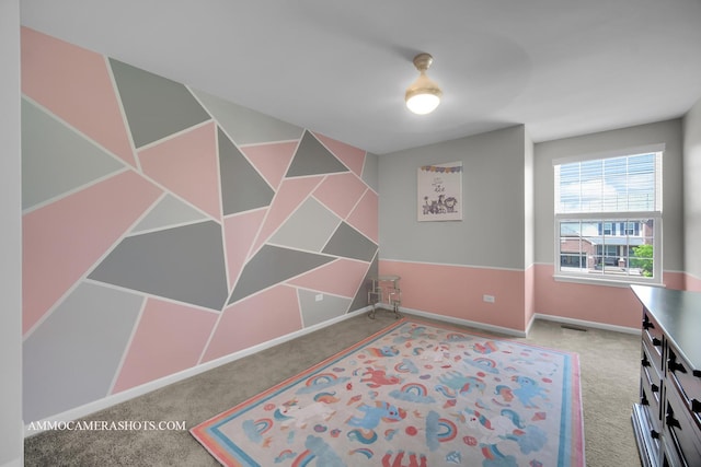 bedroom with carpet floors and baseboards