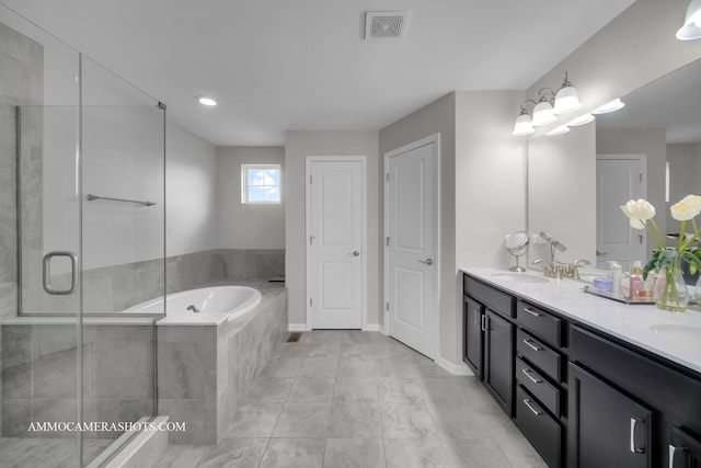 full bath with a garden tub, a shower stall, double vanity, and baseboards