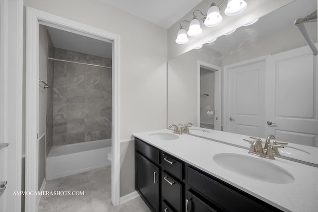 full bathroom featuring double vanity, bathtub / shower combination, toilet, baseboards, and tile patterned flooring