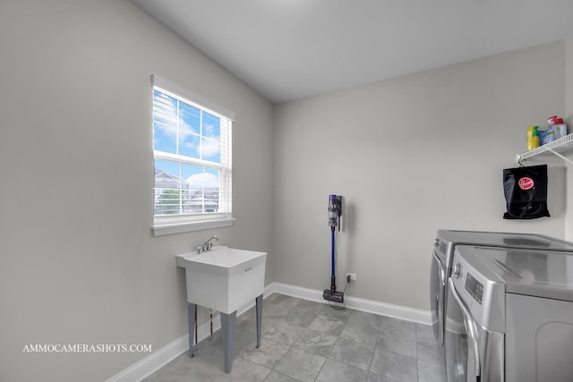 laundry room featuring washer and dryer and baseboards