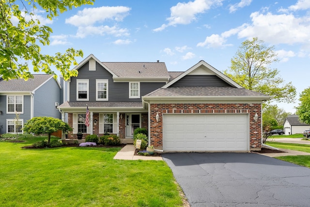 1125 Ironwood Ct, Elgin, IL 60120 - traditional home with brick siding, asphalt driveway, a front lawn, a garage, and covered porch