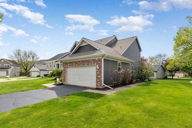 1125 Ironwood Ct, Elgin, IL 60120 - view of side of property featuring a yard, brick siding, a garage, asphalt driveway, and a shingled roof