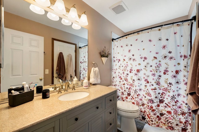 1125 Ironwood Ct, Elgin, IL 60120 - bathroom with toilet, vanity, and a shower with shower curtain