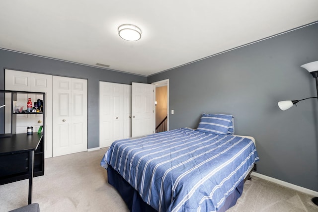 1125 Ironwood Ct, Elgin, IL 60120 - carpeted bedroom featuring multiple closets and baseboards