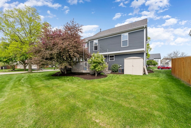 1125 Ironwood Ct, Elgin, IL 60120 - rear view of property with a deck, a lawn, and a storage shed