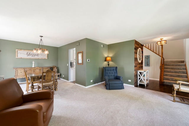 1125 Ironwood Ct, Elgin, IL 60120 - carpeted living room featuring stairway, baseboards, and a chandelier