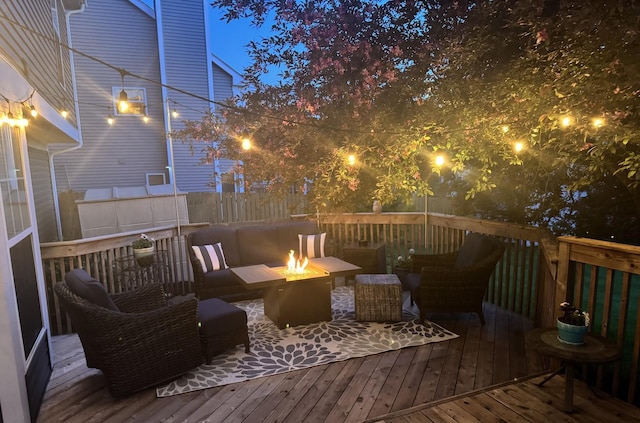 1125 Ironwood Ct, Elgin, IL 60120 - deck at twilight with an outdoor fire pit