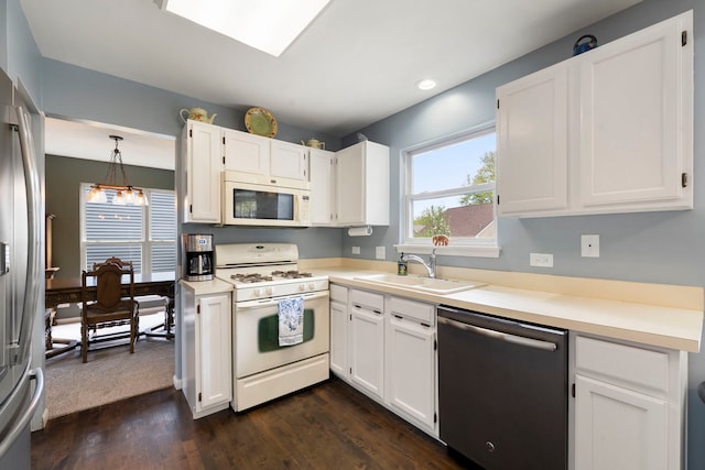 1125 Ironwood Ct, Elgin, IL 60120 - kitchen with appliances with stainless steel finishes, a sink, plenty of natural light, white cabinetry, and recessed lighting