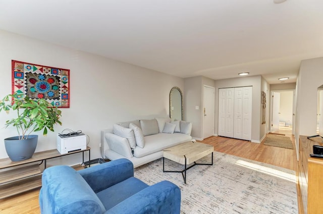 living room with wood finished floors and baseboards