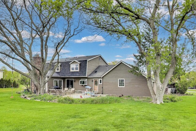 705 Skye Ln, Inverness, IL 60010 - back of property with a patio, a lawn, a shingled roof, and a chimney