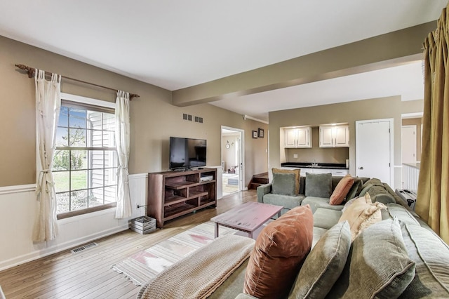 705 Skye Ln, Inverness, IL 60010 - living area featuring light wood-type flooring, baseboards, and wainscoting