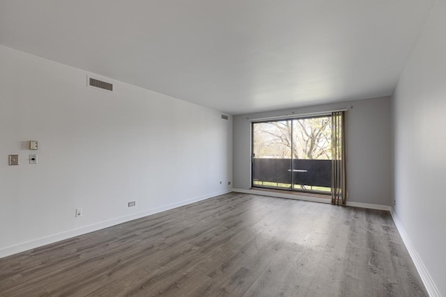 898 Wellington Ave Unit 218, Elk Grove Village, IL 60007 - empty room with wood finished floors and baseboards
