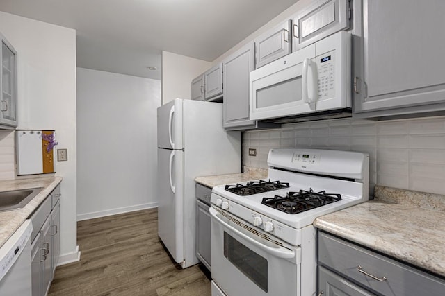 898 Wellington Ave Unit 218, Elk Grove Village, IL 60007 - kitchen with white appliances, gray cabinetry, backsplash, and light countertops