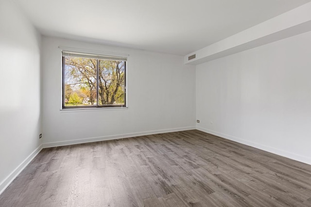 898 Wellington Ave Unit 218, Elk Grove Village, IL 60007 - unfurnished room with wood finished floors and baseboards
