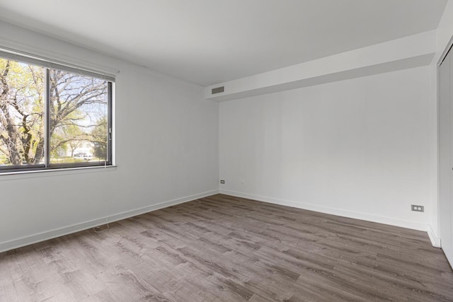 898 Wellington Ave Unit 218, Elk Grove Village, IL 60007 - spare room with baseboards and wood finished floors