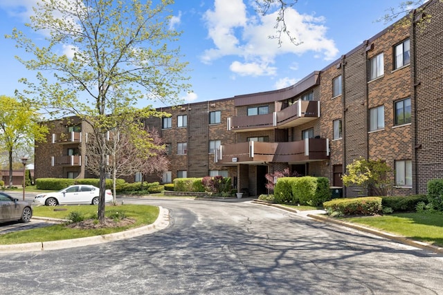 898 Wellington Ave Unit 218, Elk Grove Village, IL 60007 - view of apartment building / complex with uncovered parking