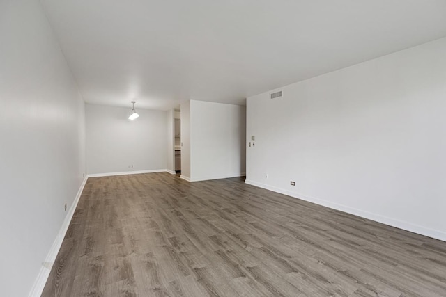 898 Wellington Ave Unit 218, Elk Grove Village, IL 60007 - empty room with wood finished floors and baseboards