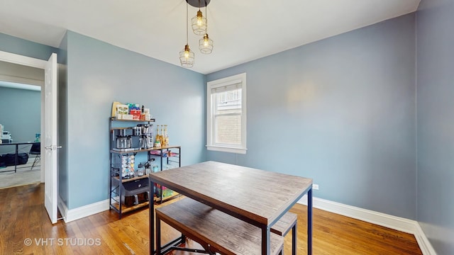 3033 Dora St, Franklin Park, IL 60131 - dining space with wood finished floors, baseboards, and a desk