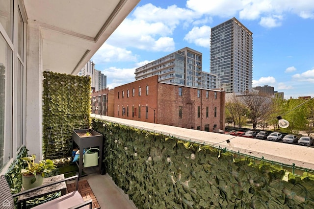 balcony featuring a view of city